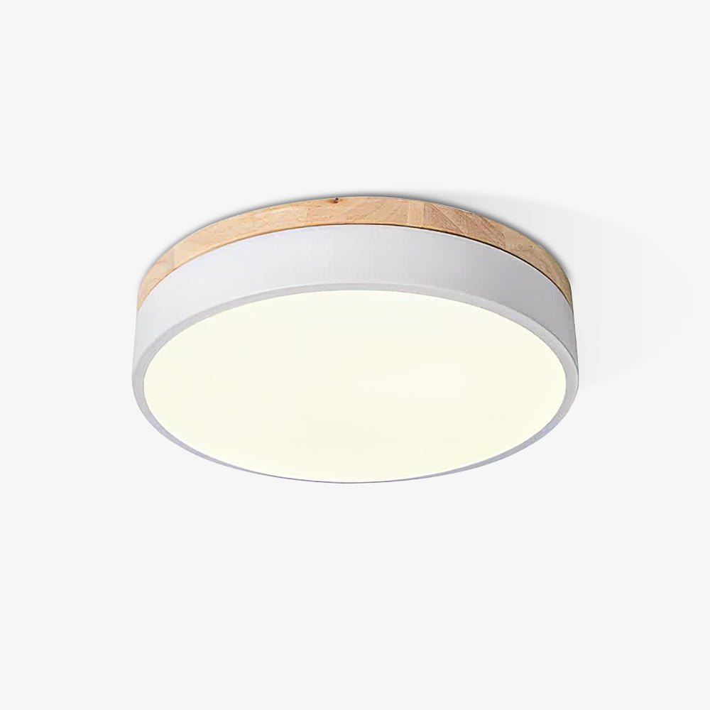 Round wood and white ceiling light lighting a corridor