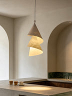 In an arched kitchen nook beside espresso cups, this Clérachic pendant shows grey and cream cones.