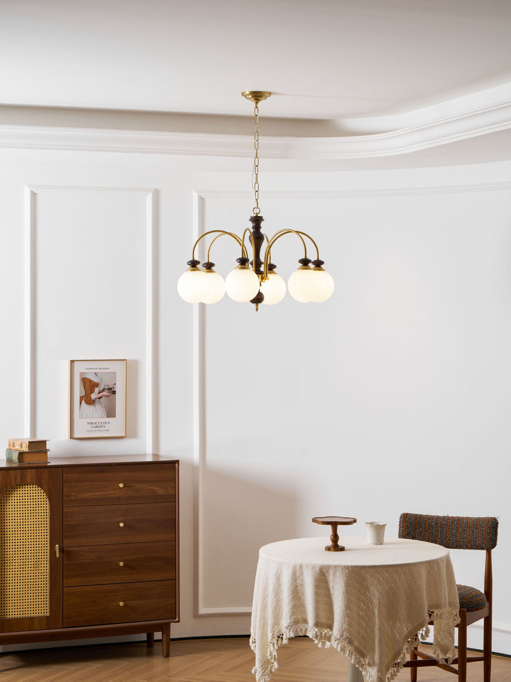 Classic chandelier with candle bulbs in a warm interior
