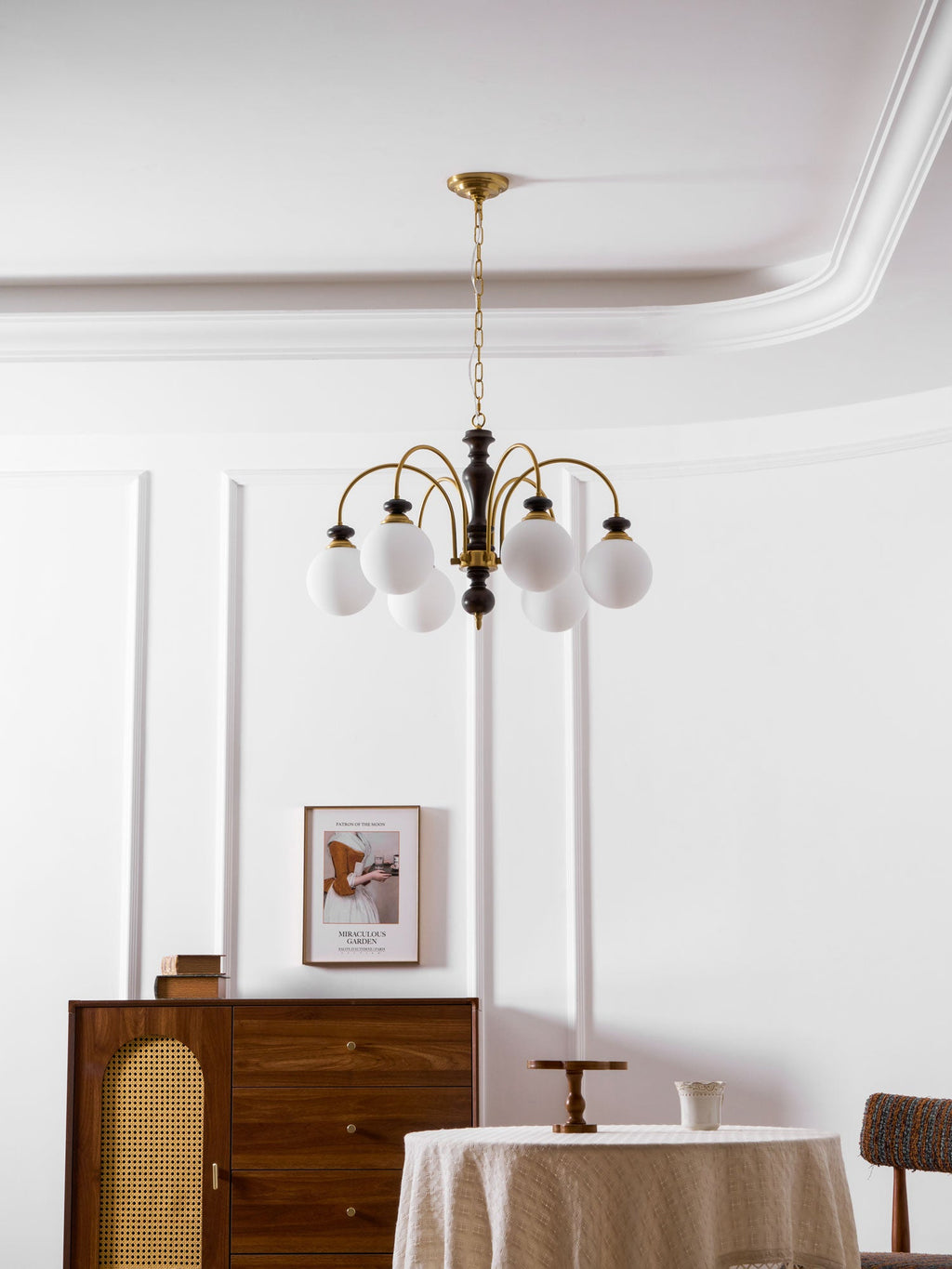 Black nickel chandelier shown against a light ceiling