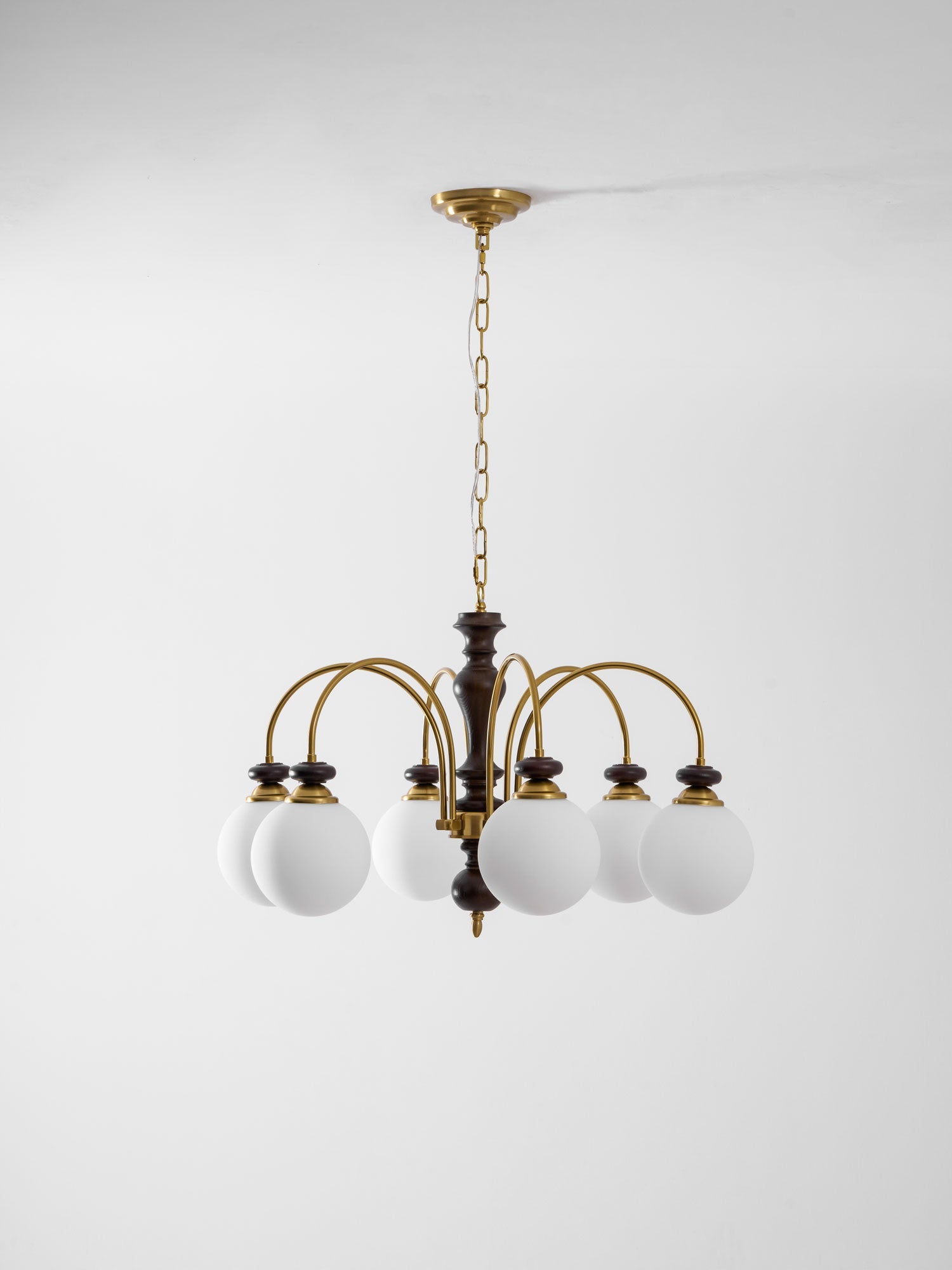 Black and nickel chandelier detail of the candle arms