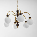 Classic chandelier with warm candle lights in an entry