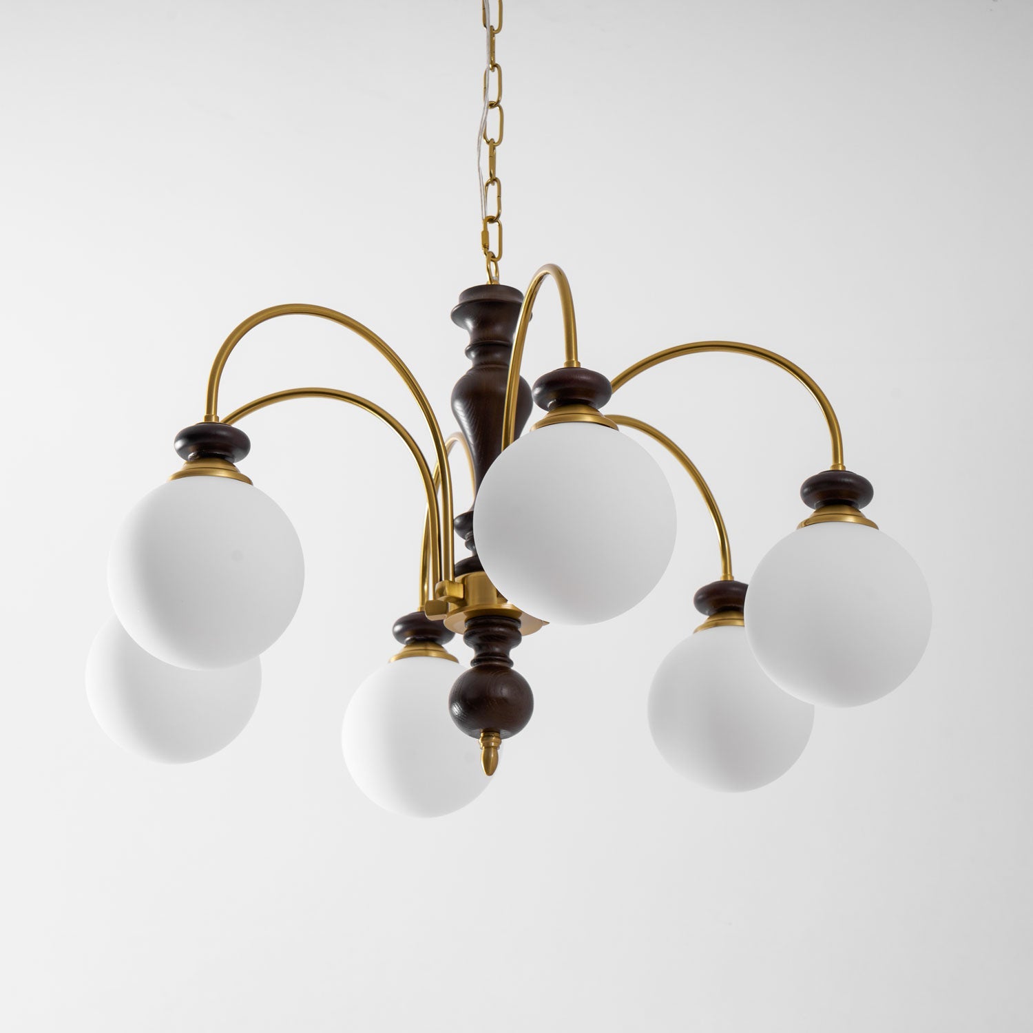 Classic chandelier with warm candle lights in an entry