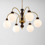 Black nickel chandelier hanging above a stairwell