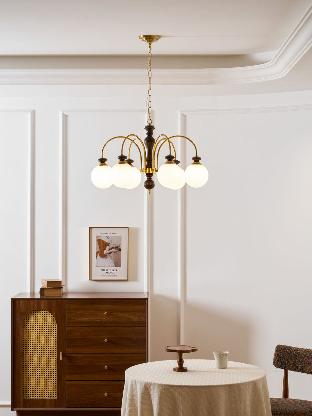 Black nickel chandelier with six candle lights glowing