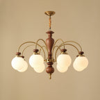 Classic chandelier frame detail in warm walnut and gold