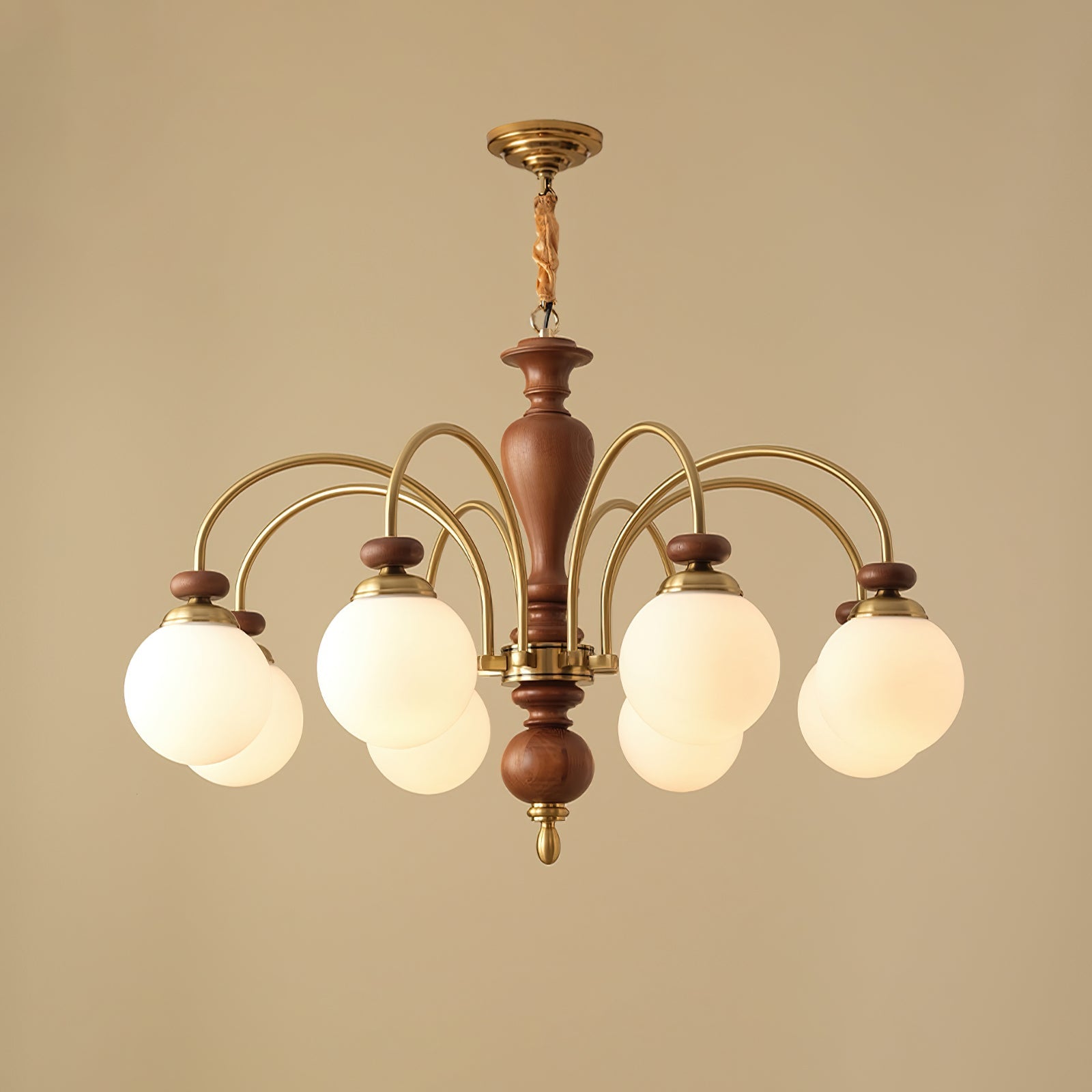 Classic chandelier frame detail in warm walnut and gold