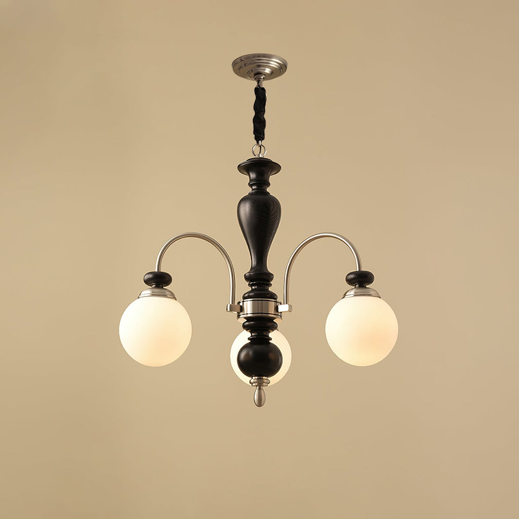 Classic chandelier in walnut and gold seen from below