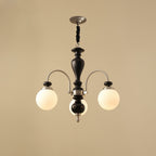 Classic chandelier in walnut and gold seen from below