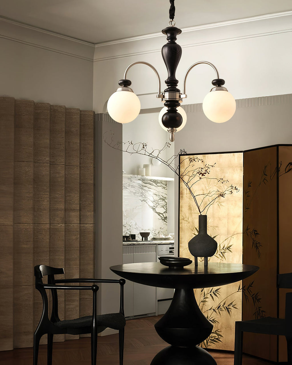 Classic chandelier with candle arms against a dark wall