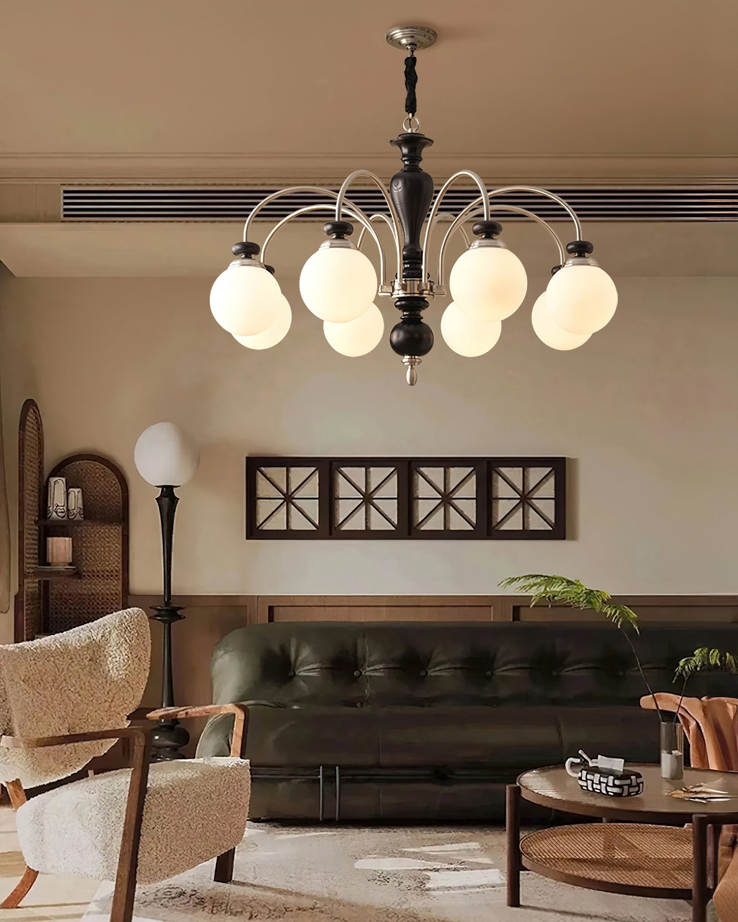 Walnut and gold chandelier hanging in a formal dining room
