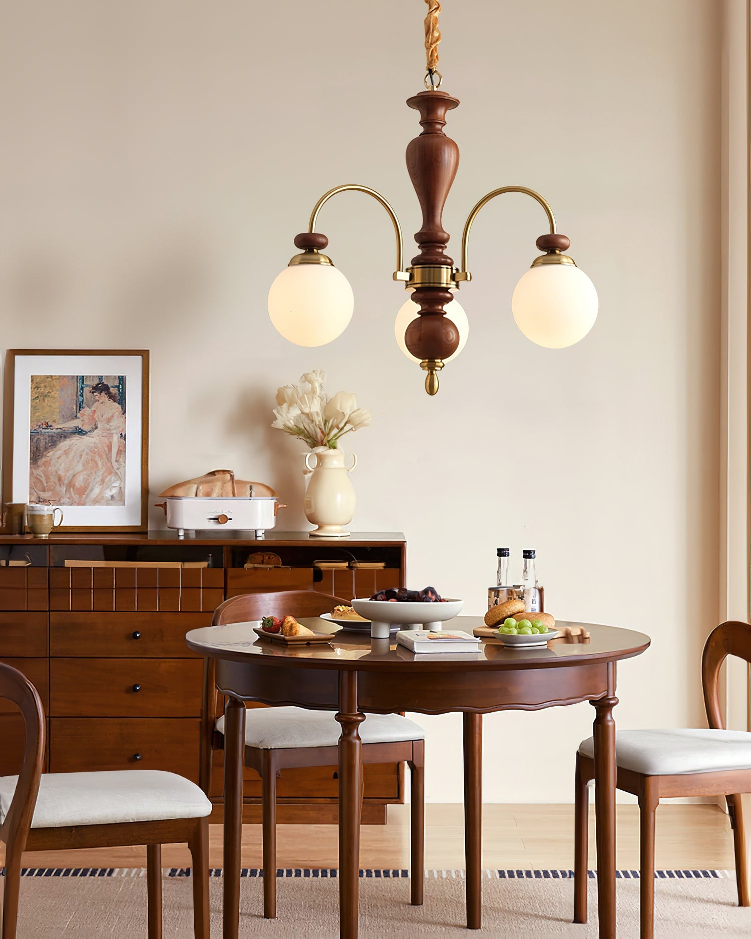 Classic chandelier glowing over a long dining table
