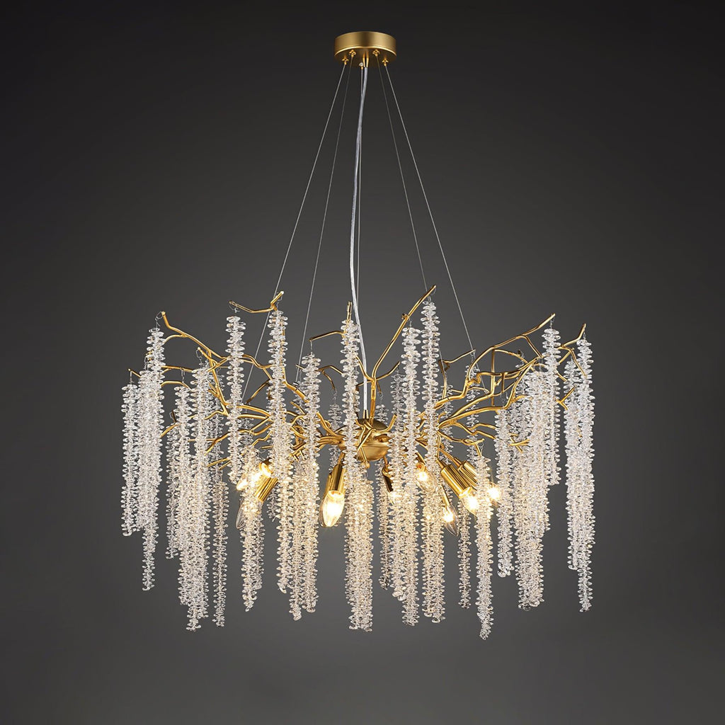 Round gold chandelier on dark grey, beaded crystal strands falling from branch-like arms.