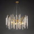 Round gold chandelier on dark grey, beaded crystal strands falling from branch-like arms.