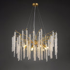 Round gold chandelier on dark grey, beaded crystal strands falling from branch-like arms.