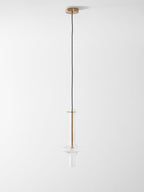 A single gold-stemmed Clérachic pendant in clear glass hangs unlit on a long drop against a plain white backdrop.