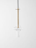 A close view of this Clérachic pendant shows its gold-toned stem and crossbar fitting against clear glass, unlit.