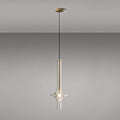 A single gold-stemmed Clérachic pendant with a matching gold ceiling canopy hangs against a plain grey backdrop.