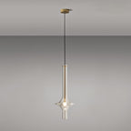 A single gold-stemmed Clérachic pendant with a matching gold ceiling canopy hangs against a plain grey backdrop.