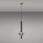 A single gold-stemmed Clérachic pendant in smoky grey glass hangs unlit against a plain grey backdrop, its gold canopy visible above.
