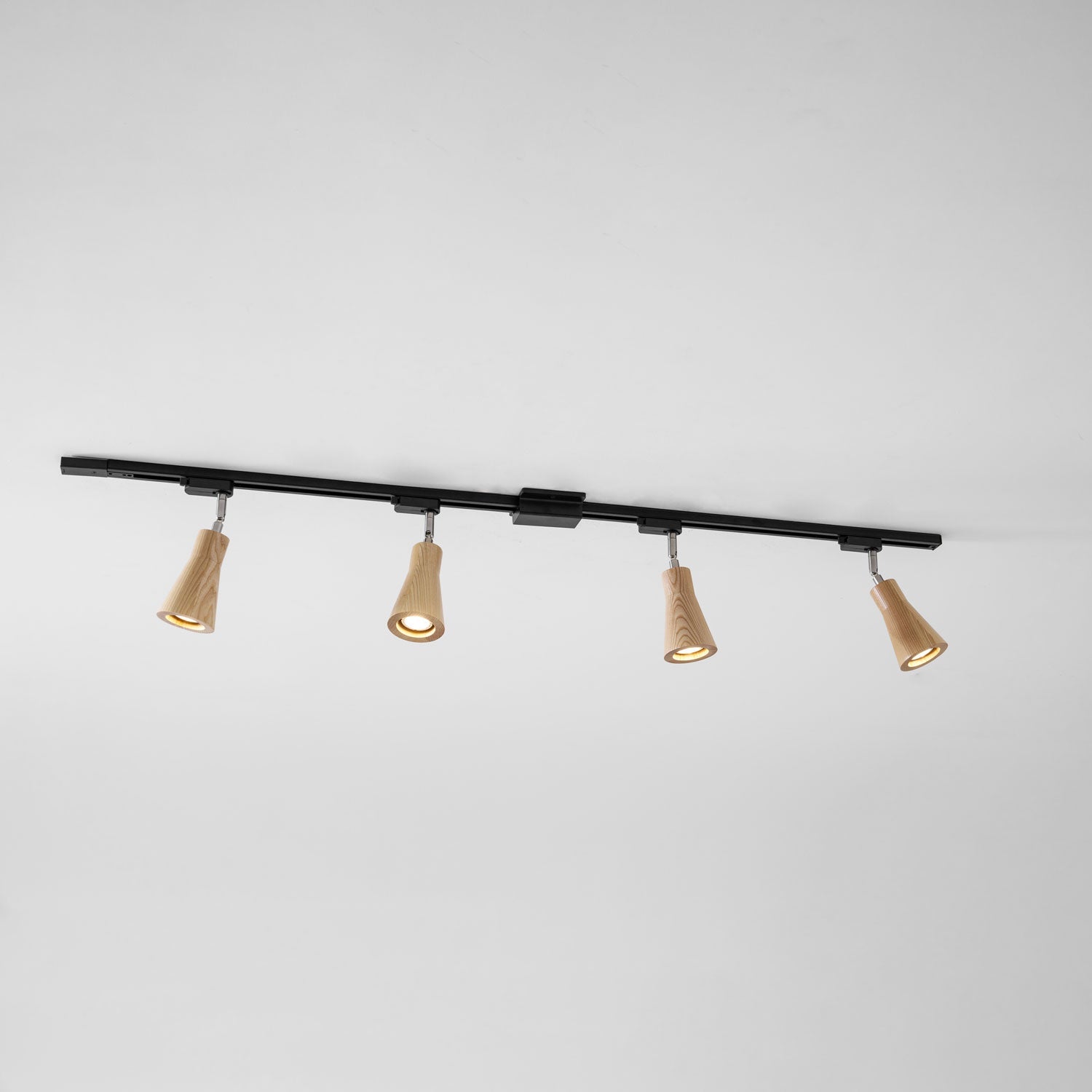 Wood track ceiling lamp shown installed across a ceiling