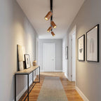 Wood track ceiling lamp lighting an open-plan living space