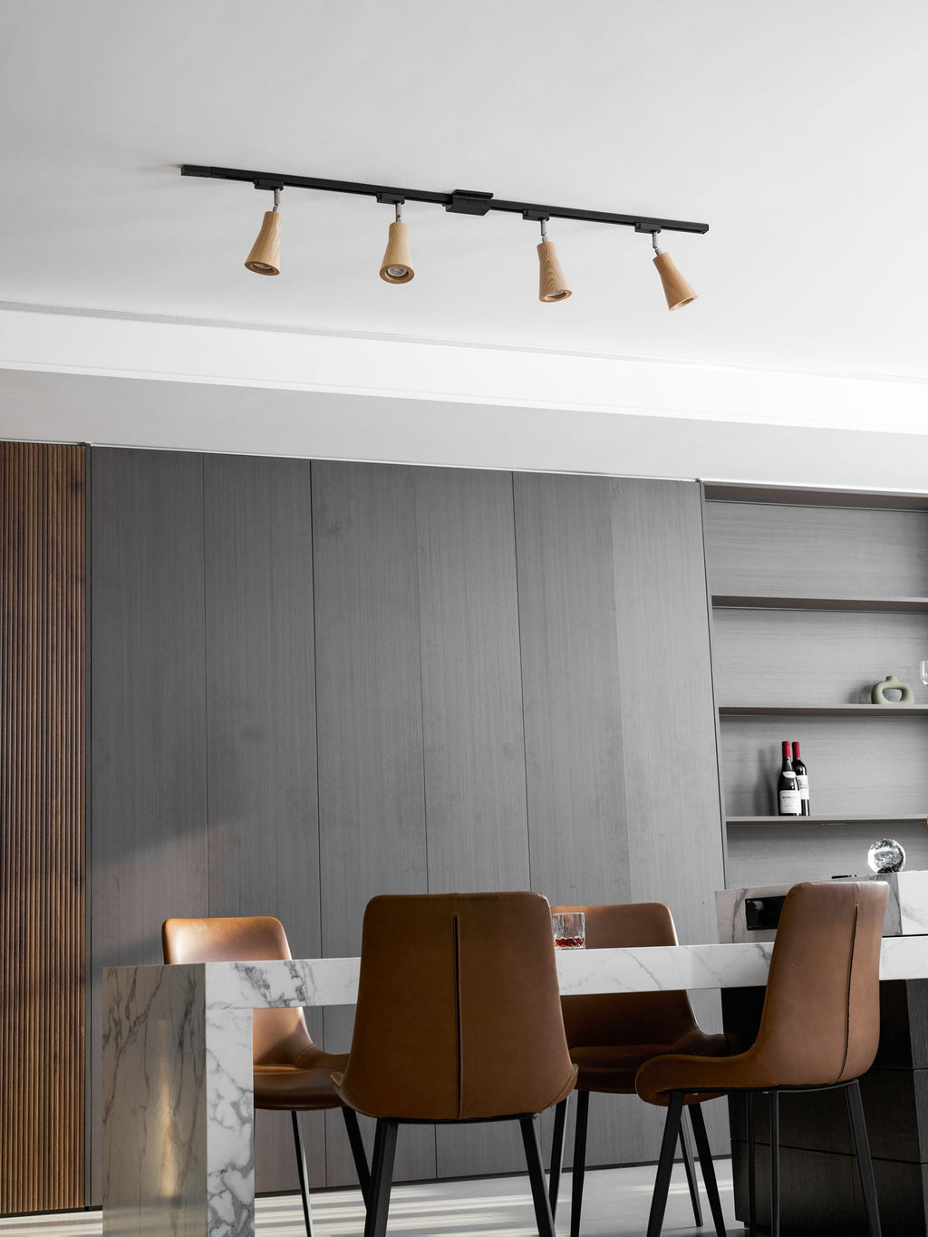 Wood track ceiling lamp with warm spotlights over a seating area