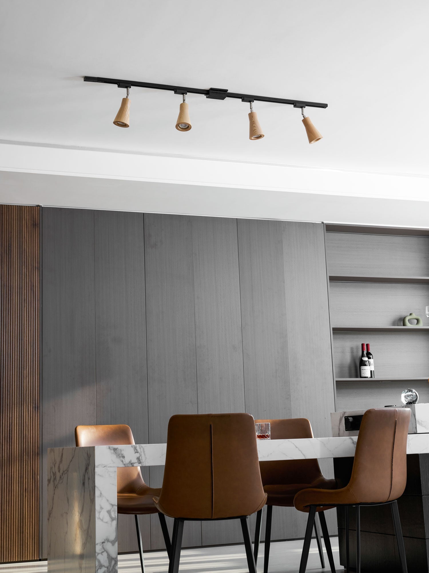 Wood track ceiling lamp with warm spotlights over a seating area