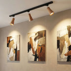 Wood track ceiling lamp with directional spotlights over a hallway