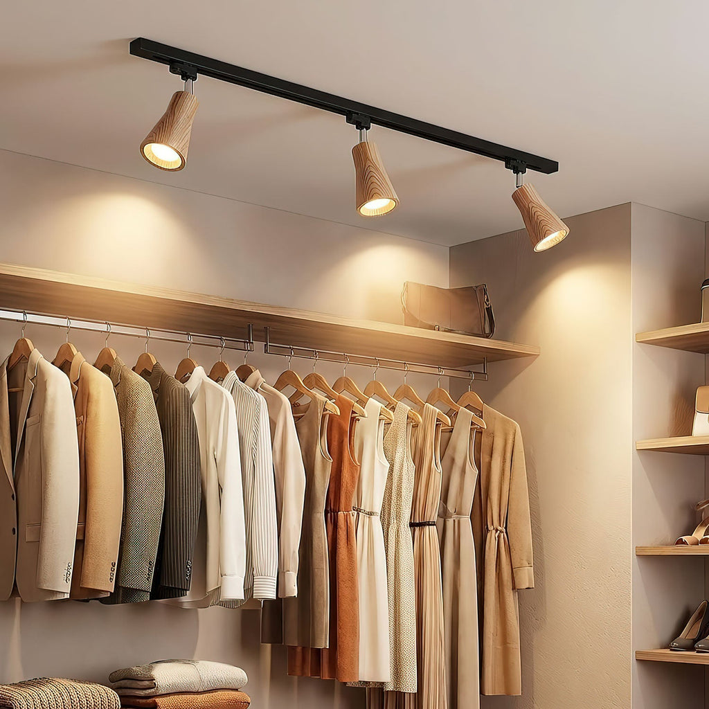Wood track ceiling lamp with adjustable heads in a styled interior