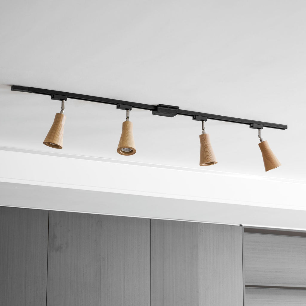 Wood track ceiling lamp with spotlights angled toward shelving