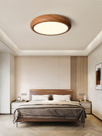 Walnut round ceiling light detail of the white panel