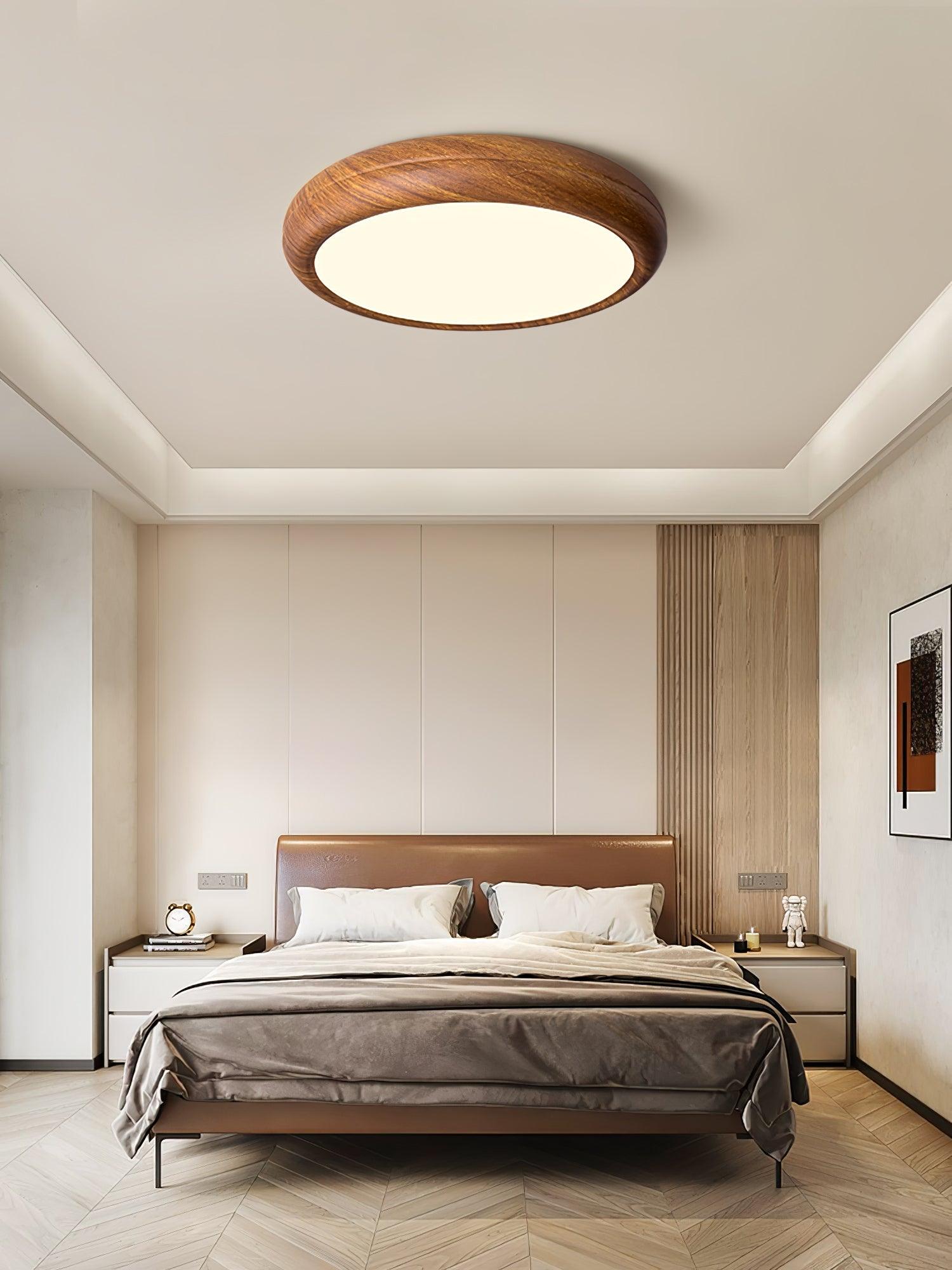 Walnut round ceiling light detail of the white panel