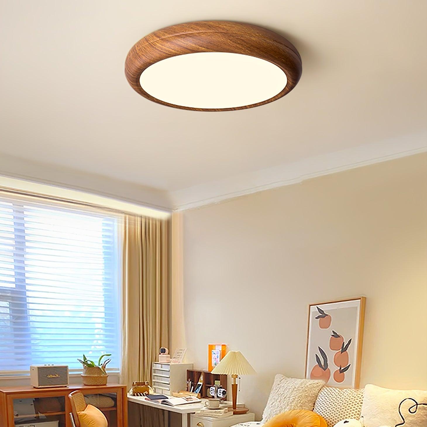 Round walnut ceiling light in a modern living space