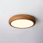 Round walnut ceiling light lighting a quiet corner