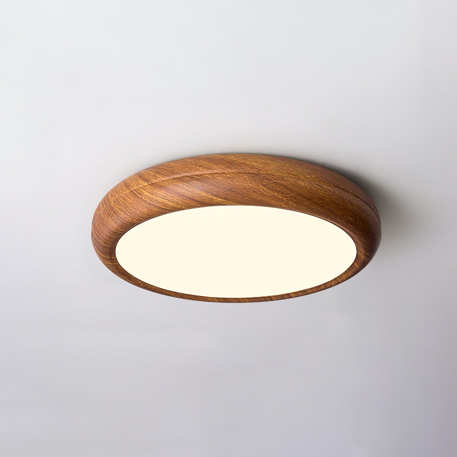 Round walnut ceiling light lighting a quiet corner
