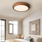 Wood grain ceiling light with white diffuser in a hall