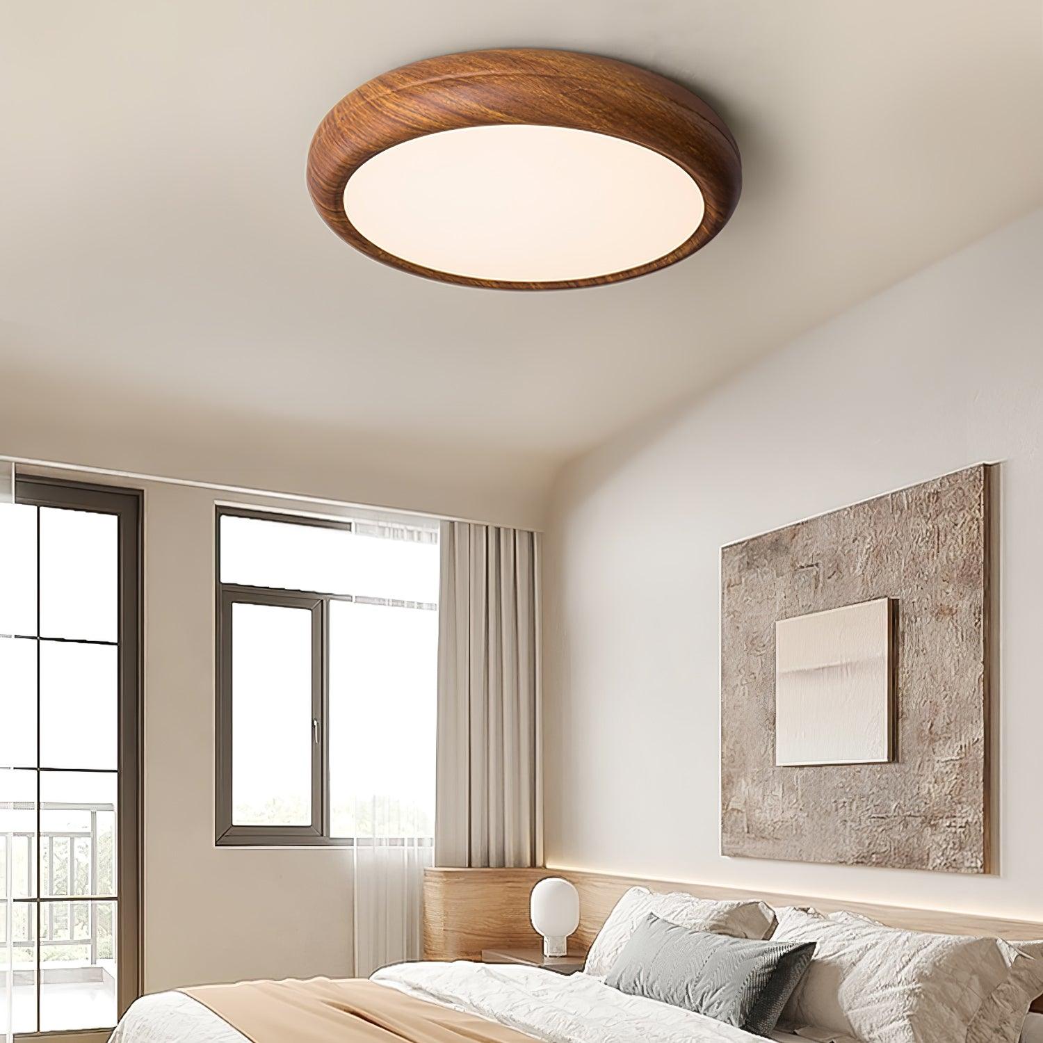 Wood grain ceiling light with white diffuser in a hall