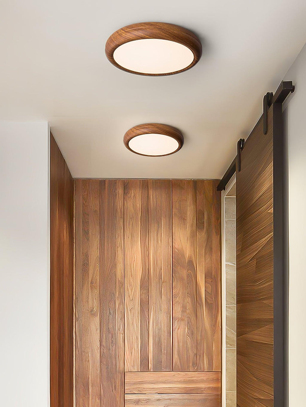 Walnut round ceiling light shown lit in an open room