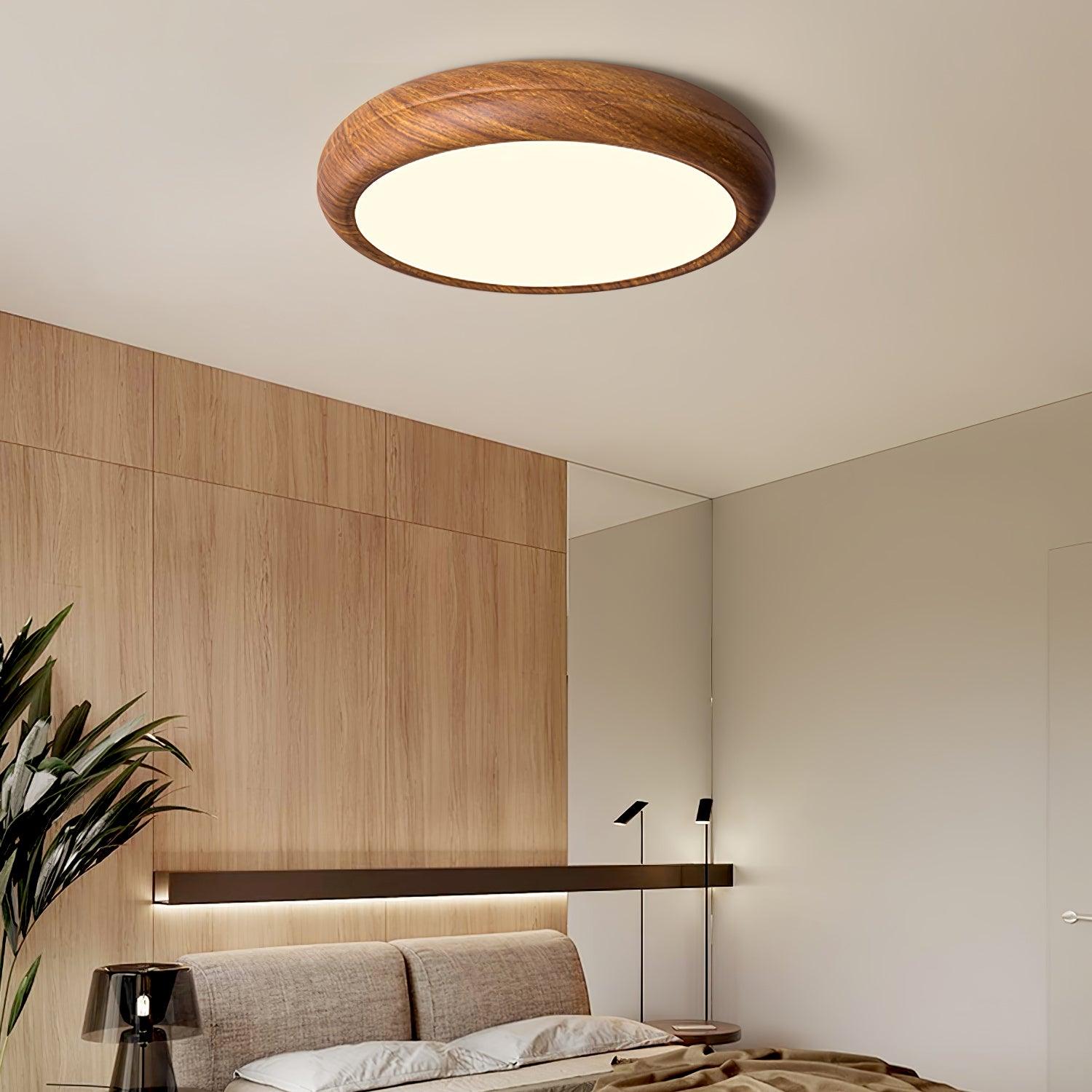 Wood grain ceiling light glowing in a dim hallway