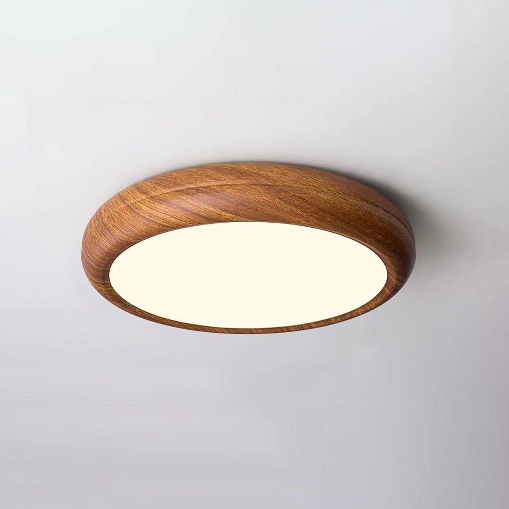 Wood grain ceiling light glowing softly in a bedroom