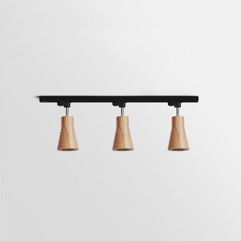 Wood track ceiling lamp angled to direct light across a room