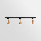 Wood track ceiling lamp lighting a kitchen with warm spotlights