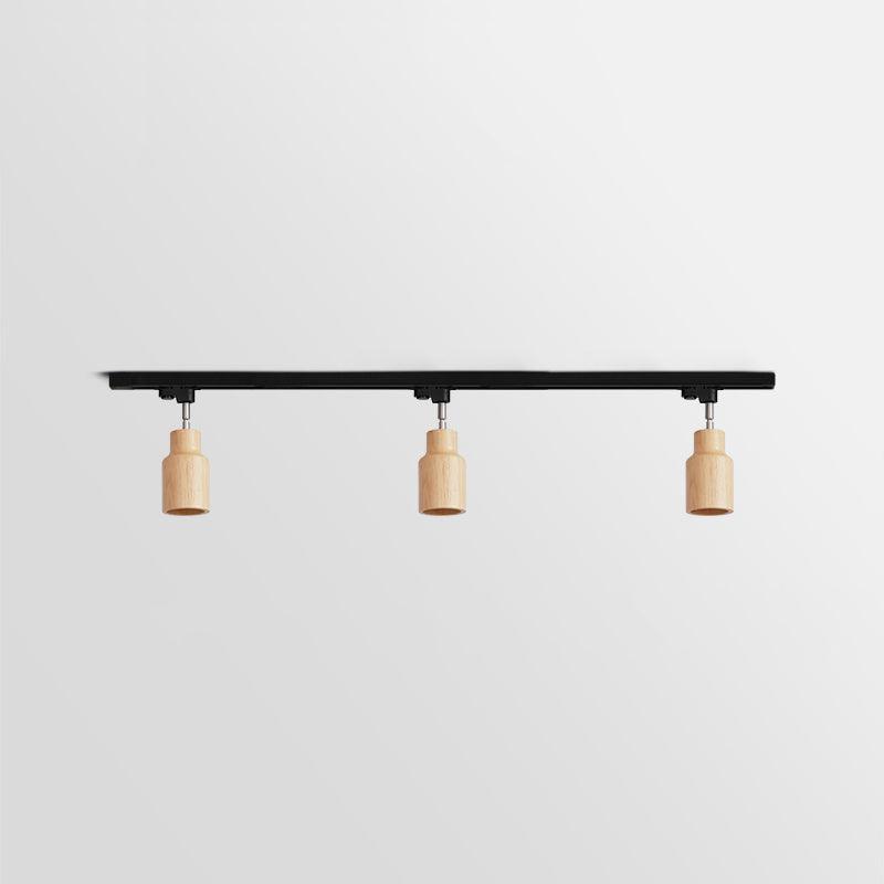 Wood track ceiling lamp shown from below with adjustable heads