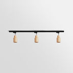 Wood track ceiling lamp shown from below with adjustable heads