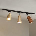 Wood track ceiling lamp lighting a workspace with focused beams