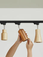 Wood track ceiling lamp with spotlights over a kitchen counter