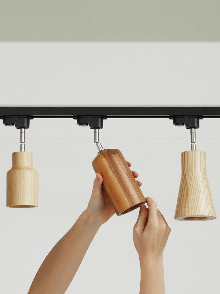 Wood track ceiling lamp with spotlights over a kitchen counter