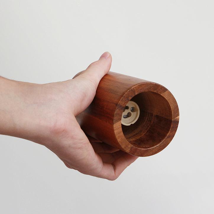 Wood track ceiling lamp with three heads in a styled interior
