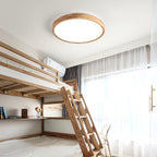 Wooden geometric ceiling light glowing in a styled space